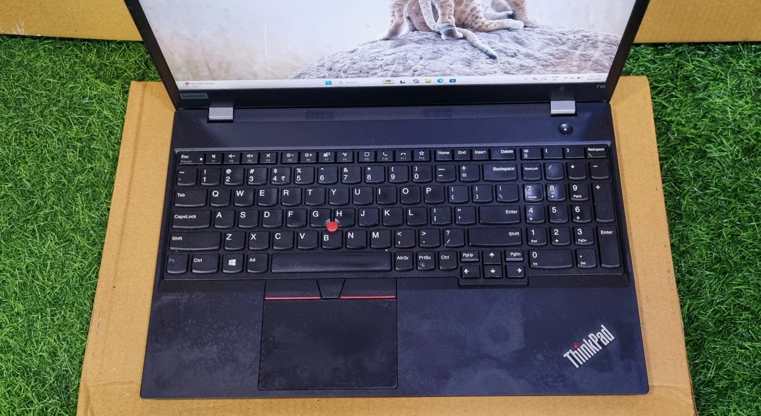 Lenovo ThinkPad T15 top view of full-size keyboard with numeric keypad and red TrackPoint