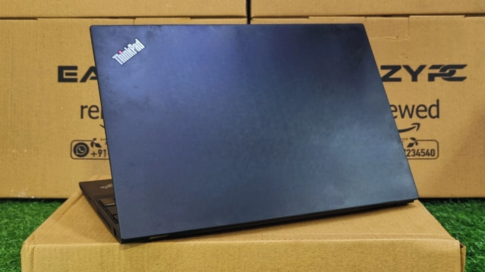 Lenovo ThinkPad T15 back view of matte black carbon-fiber lid with ThinkPad logo